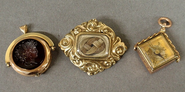 Appraisal: - Two Victorian watch fobs- k gold w Roman head