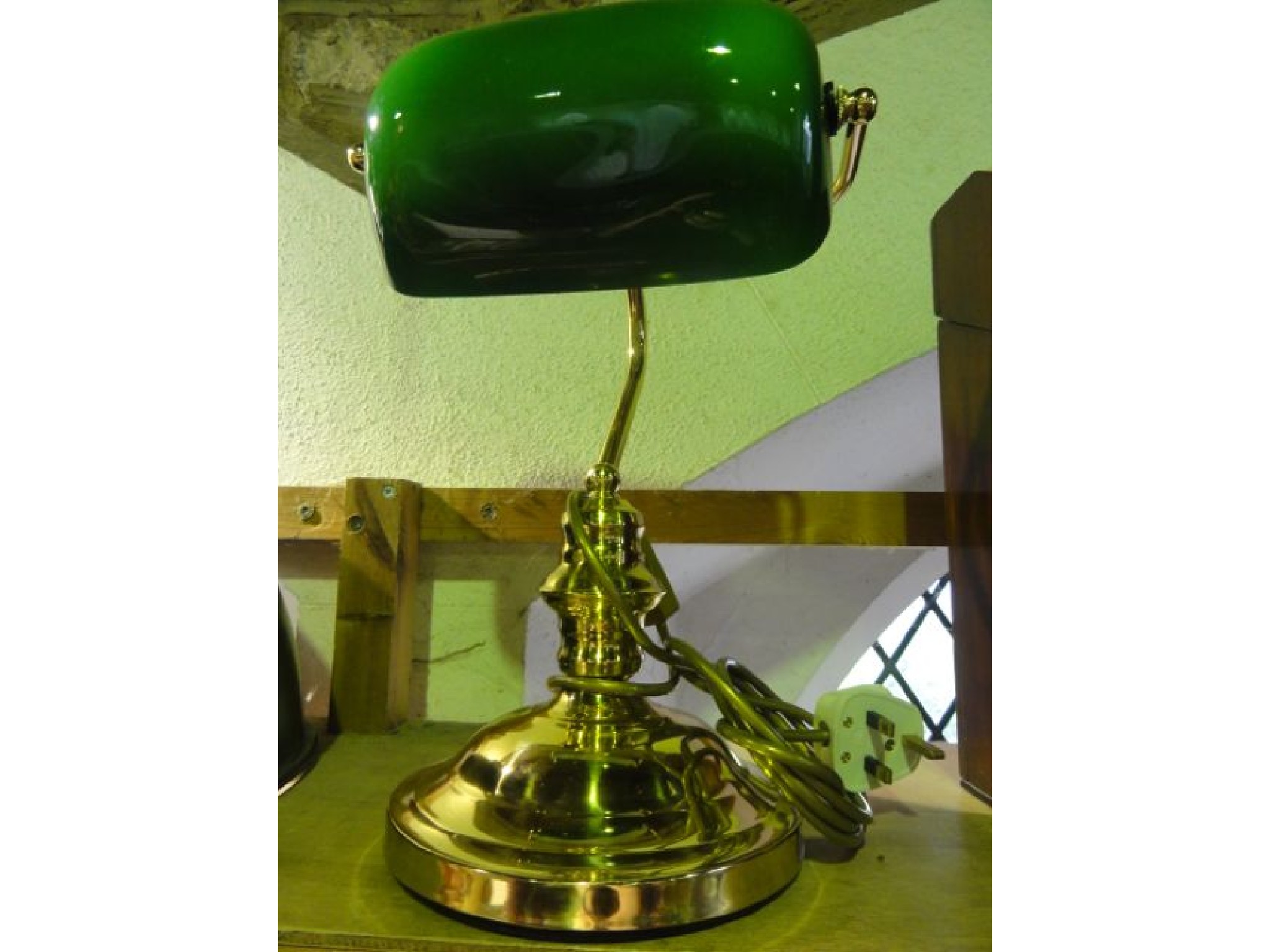 Appraisal: A reproduction desk lamp principally in brass with an opaque