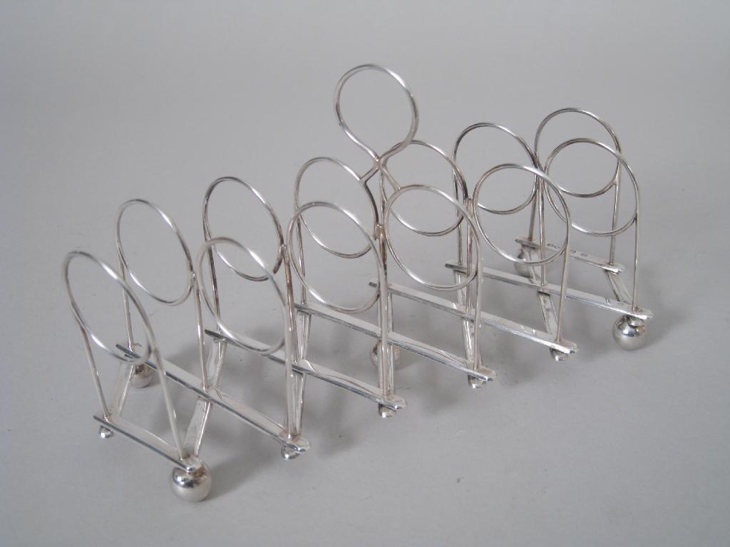 Appraisal: A Victorian seven bar wire work Extending Toast Rack with