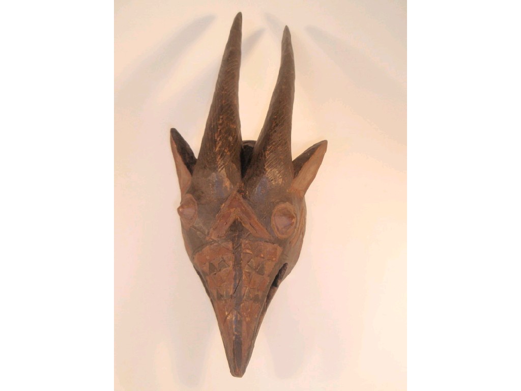 Appraisal: A Mossi antelope mask painted in black and red