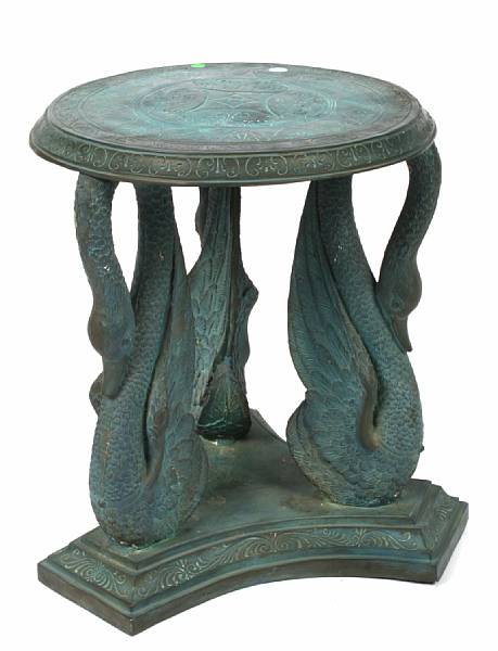 Appraisal: A patinated bronze table with swan supports height in width