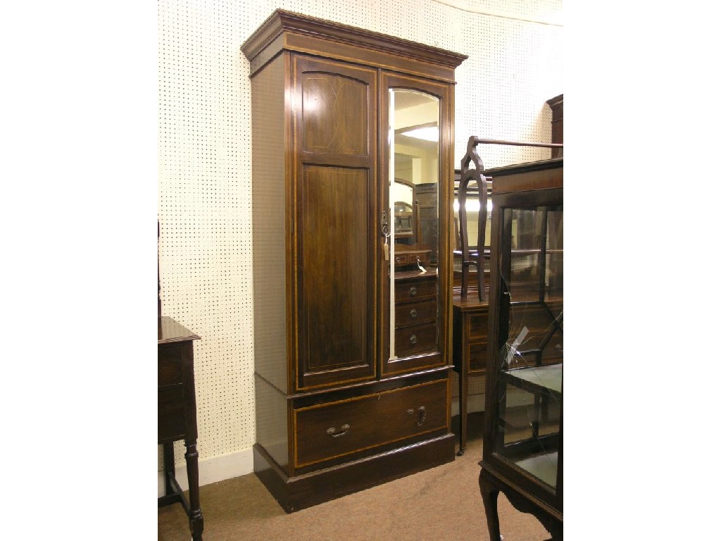 Appraisal: An Edwardian inlaid mahogany bedroom pair consisting of wardrobe with