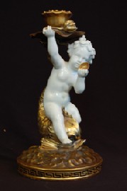 Appraisal: TH CENTURY MOORE BROS FIGURAL CANDLE HOLDER