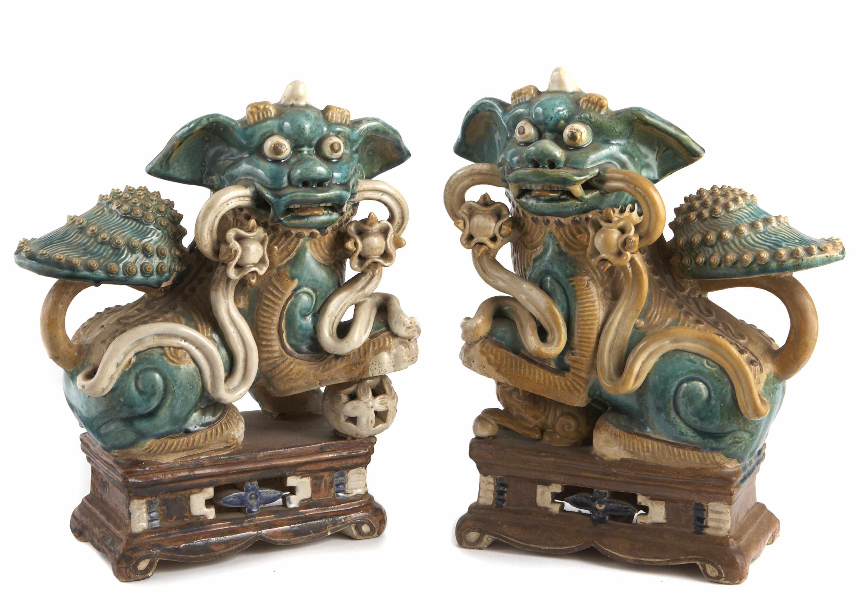 Appraisal: A pair of Chinese sancai glazed pottery figural roof tiles