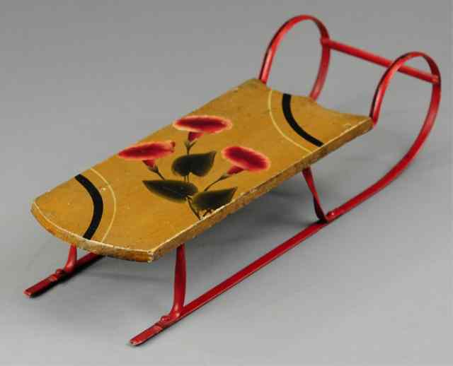 Appraisal: MINIATURE SLED Early wood body with pressed steel runners hand