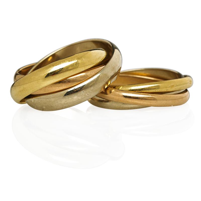 Appraisal: TWO CARTIER TRINITY K GOLD ROLLING RINGS Classic yellow white