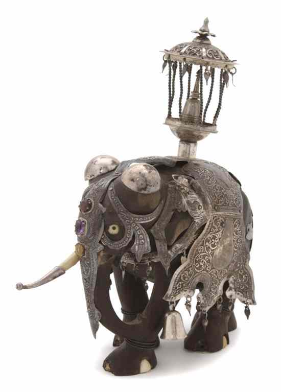 Appraisal: An Indian Carved Wood and Silver Mounted Elephant the animal