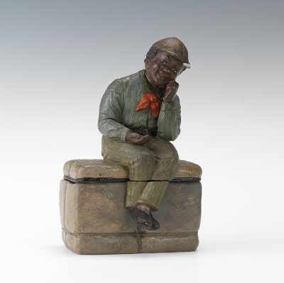 Appraisal: Johann Maresch Black Figural Tobacco JarSeated Boy on Parcel Ceramic