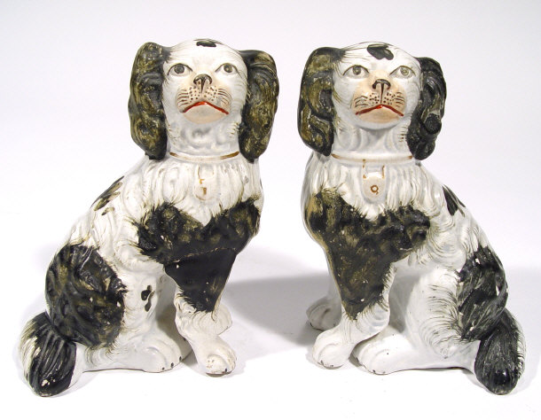 Appraisal: Pair of Victorian Staffordshire spaniels with hand painted black decoration