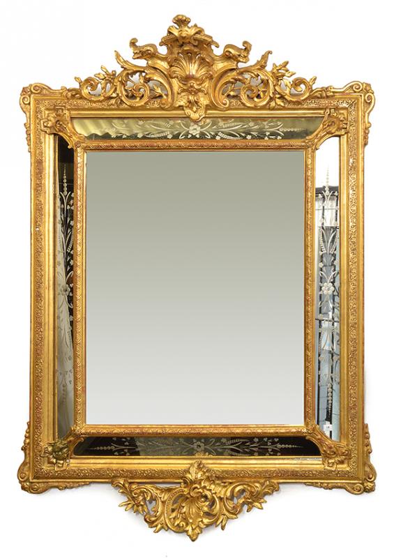 Appraisal: A FRENCH GILTWOOD FRAMED CUSHION FRONT MIRROR the bevelled plate