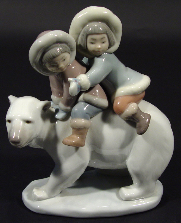 Appraisal: Lladro porcelain figure group of Eskimo children on a polar