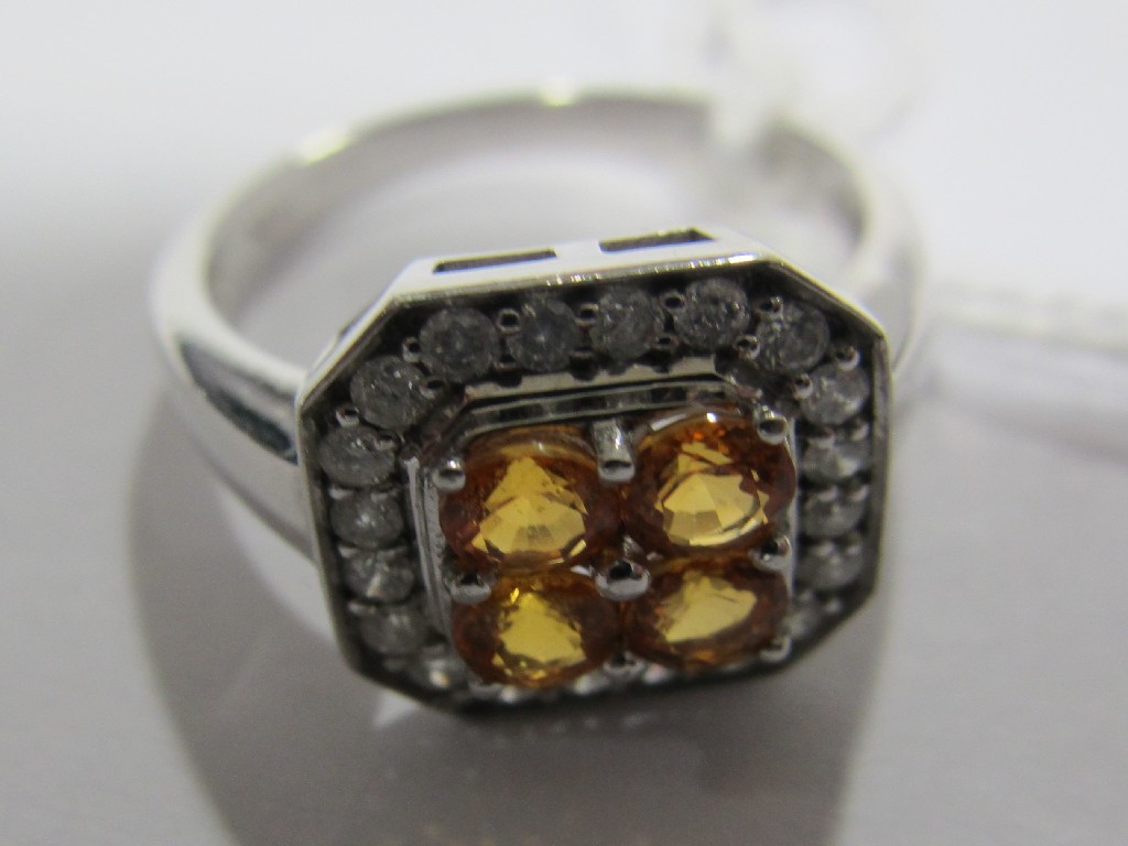 Appraisal: Nine carat white gold citrine and diamond cluster ring with