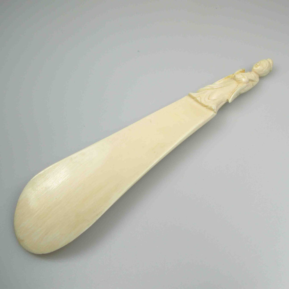 Appraisal: Carved Ivory Figural Shoe Horn length in cm