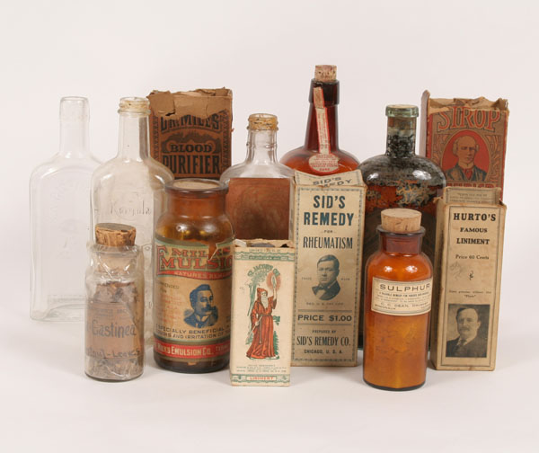 Appraisal: Medicine bottles two embossed with portrait of inventor also includes