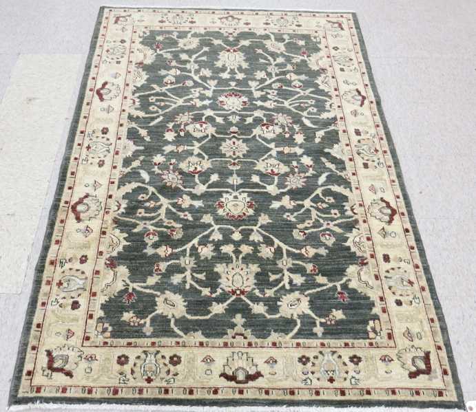 Appraisal: HAND KNOTTED ORIENTAL AREA RUG Pakistani-Parisian overall floral decoration on