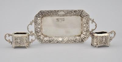 Appraisal: A Miniature Silver Tray Sugar and Creamer Each piece embellished