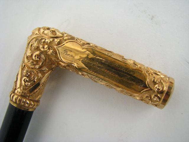 Appraisal: A Victorian Walking Stick with Embossed Gold Filled Handle inscribed