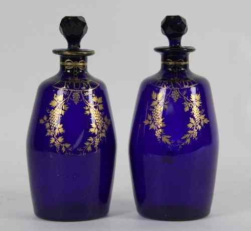 Appraisal: A pair of blue glass spirit decanters inscribed Brandy and