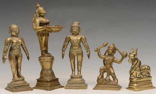 Appraisal: A GILT BRONZE MODEL OF AN INDIAN DEITY holding an