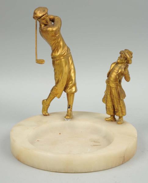 Appraisal: Ashtray With Golfing Figures This ashtray depicts a golfer and