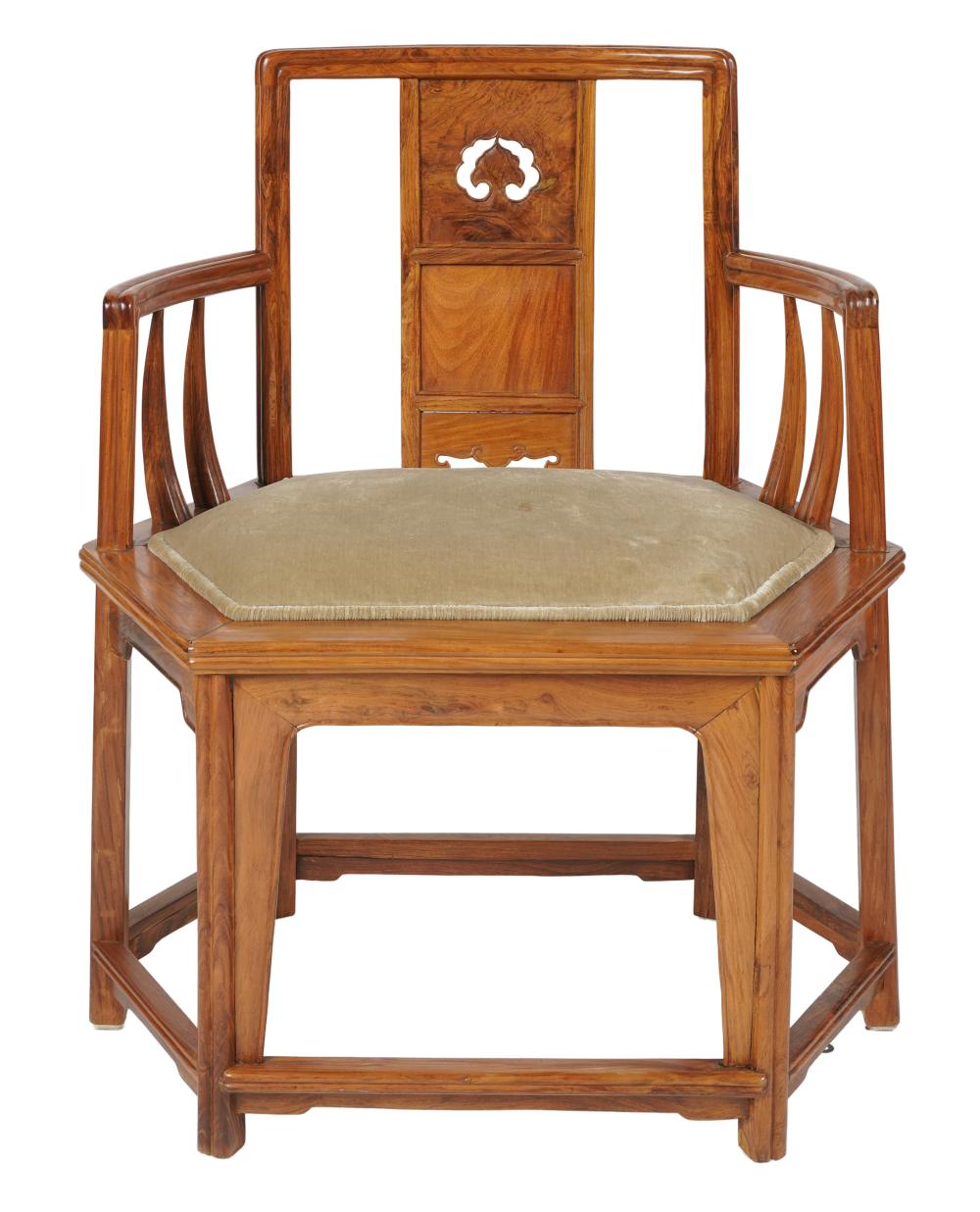 Appraisal: CHINESE CARVED HARDWOOD ARMCHAIRthe hexagonal seat inset with fixed beige