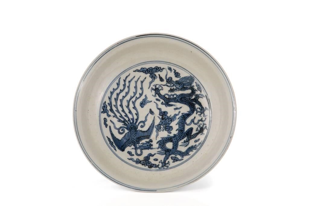 Appraisal: Chinese in blue and white palette featuring dragon and phoenix