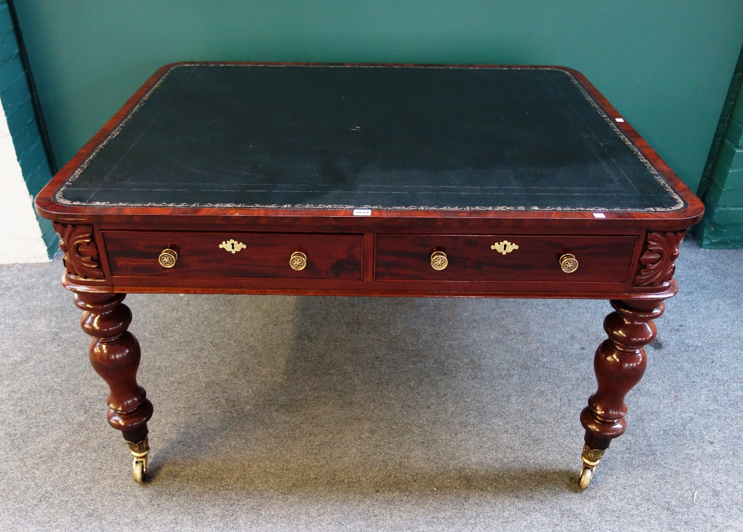 Appraisal: A mid th century mahogany writing table the rounded rectangular