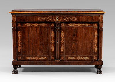 Appraisal: Egyptian Revival rosewood cabinet Egyptianate column-form pilasters and carved paw