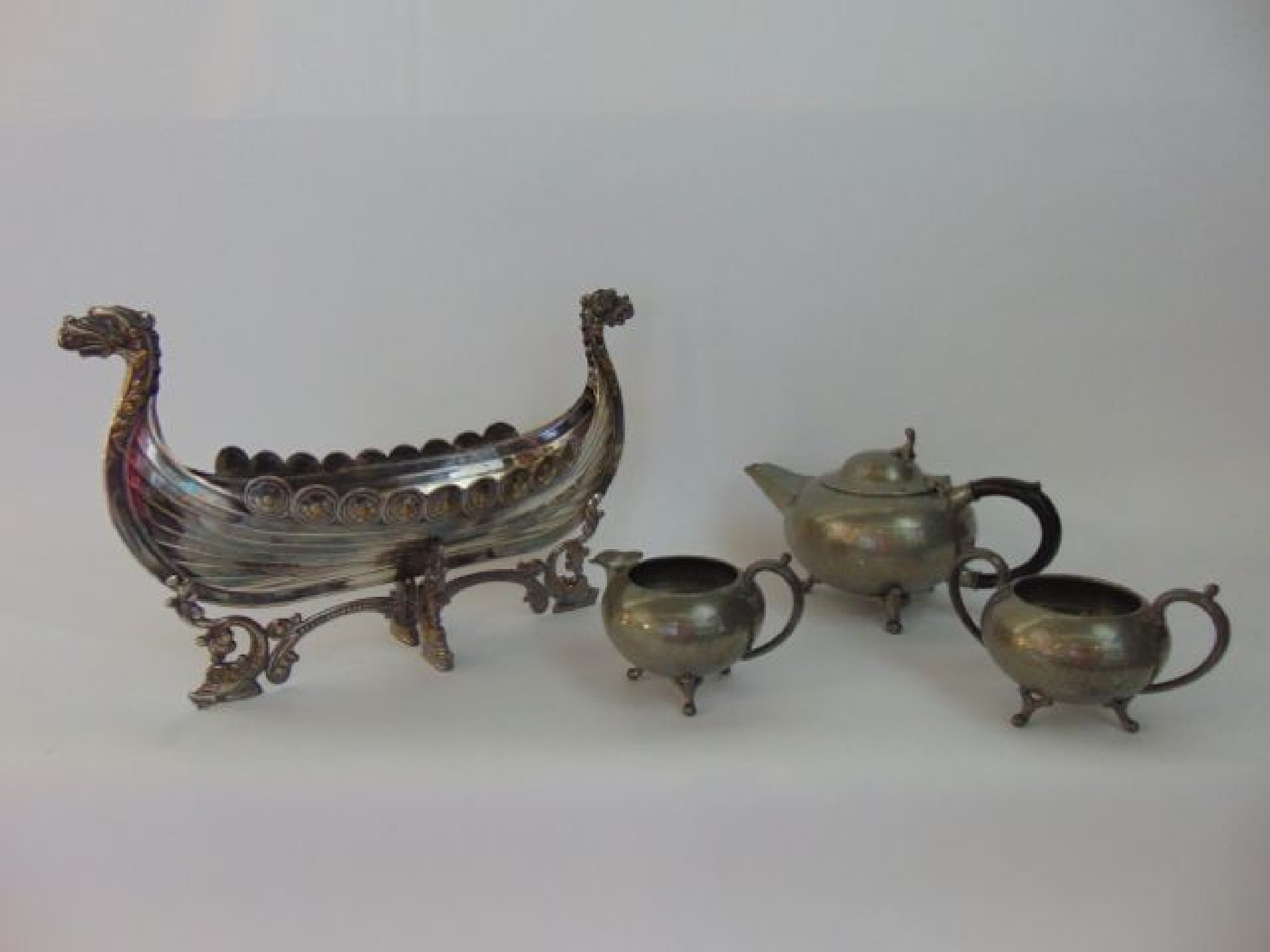 Appraisal: An unusual silver plated model of a stylised Viking longboat