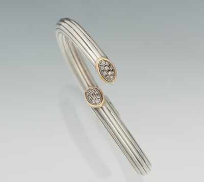 Appraisal: A Sterling Silver and Diamond Bangle Bracelet Sterling silver hinged