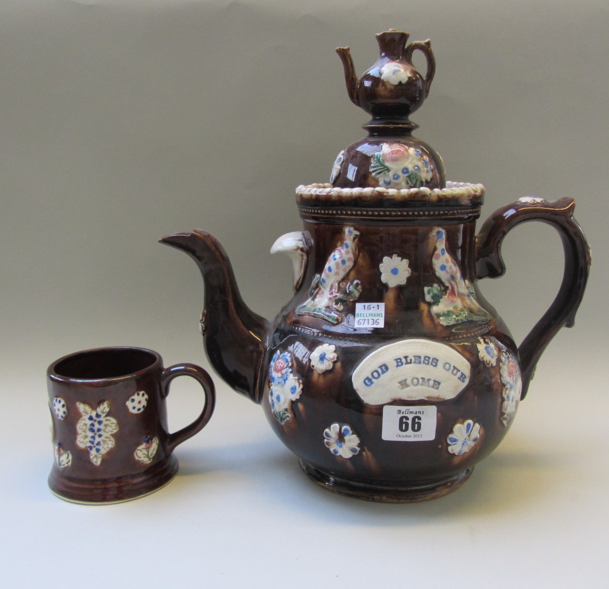 Appraisal: A Bargeware teapot and cover of typical form th century