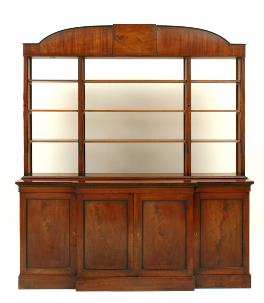 Appraisal: A GEORGE III FLAME MAHOGANY OPEN BOOKCASE The arched string