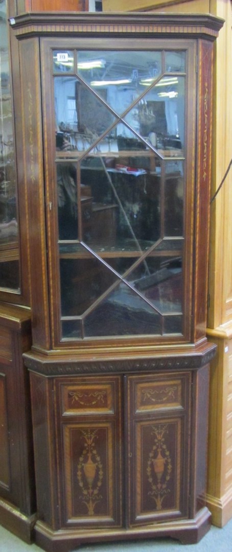 Appraisal: A late th century marquetry inlaid mahogany corner display cabinet