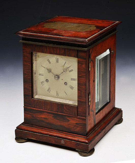 Appraisal: A VICTORIAN ROSEWOOD DESK MANTEL CLOCK with square gilt engine