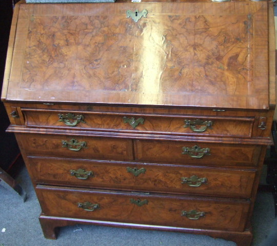 Appraisal: A walnut cross-banded bureau circa probably Dutch the sloping fall