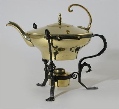 Appraisal: A John W Singer Sons brass kettle on a wrought