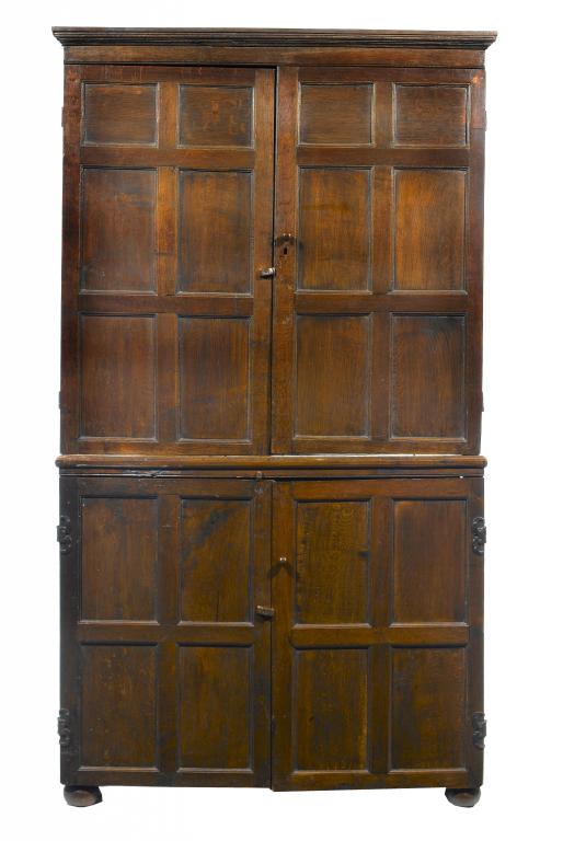 Appraisal: A GEORGE III JOINED OAK CUPBOARD the moulded cornice above