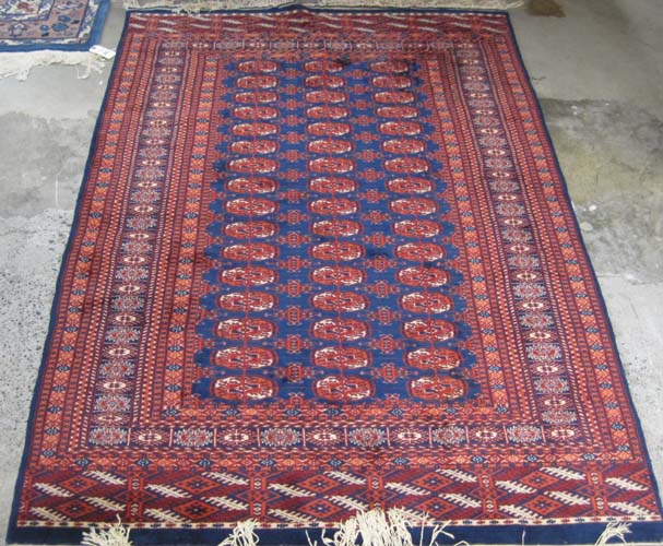 Appraisal: BLUE FIELD BOKHARA AREA RUG hand knotted ' x '