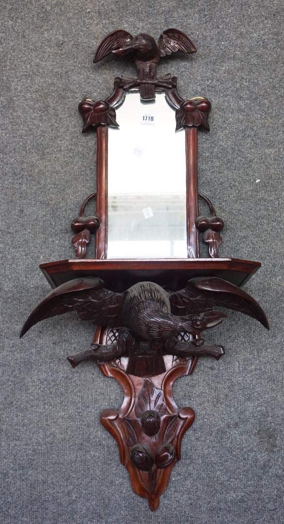 Appraisal: A th century Black Forest carved wood hall mirror with