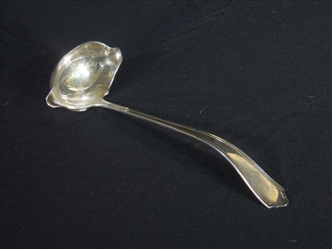 Appraisal: AMERICAN SILVER PUNCH LADLE A Stowell Sterling cast with a