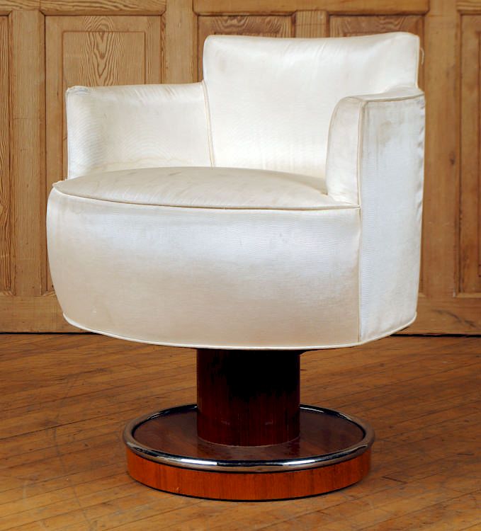 Appraisal: CREAM SWIVEL CHAIR ON WOOD AND CHROME BASE An Art