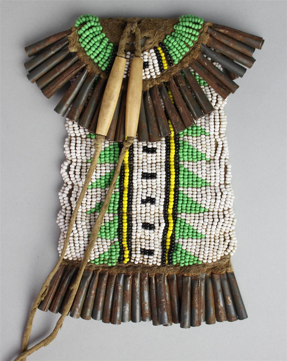 Appraisal: PLAINS BEADED STRIKELITE BAG WITH METAL CONE FRINGE green yellow