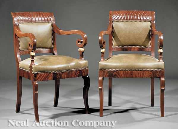 Appraisal: A Pair of Baltic Carved Mahogany Armchairs feather-carved crest rails