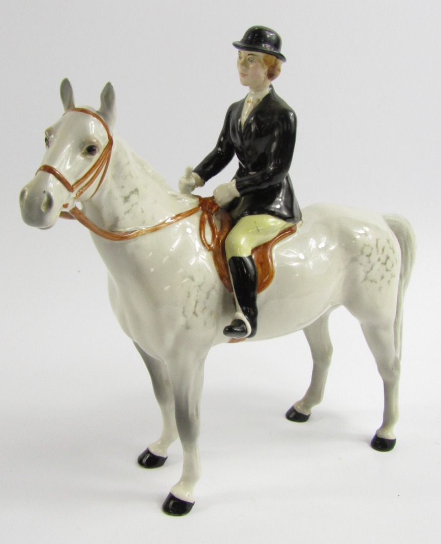 Appraisal: A Beswick pottery figure of a hunts woman mounted upon