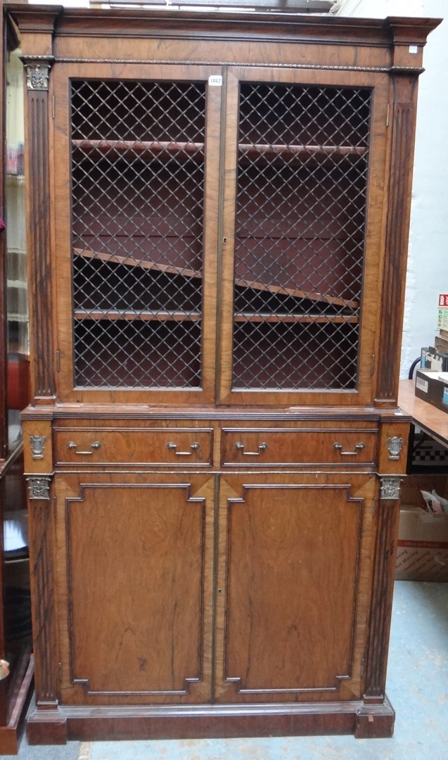 Appraisal: A Regency design rosewood bookcase cupboard with pair of grille