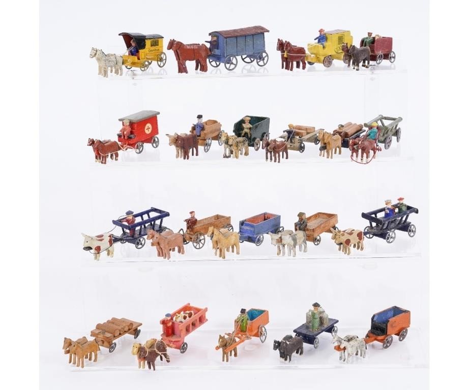 Appraisal: Twenty Putz horse-drawn vehicles assorted horse and ox pulled vehicles