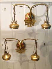 Appraisal: A pair of double brass wall lights in the Art