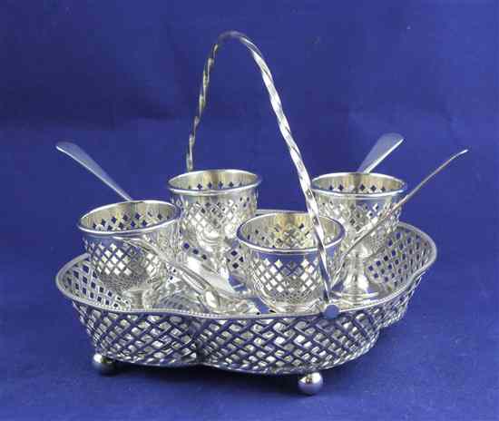 Appraisal: An Edwardian silver quatrefoil egg cruet stand of pierced basket