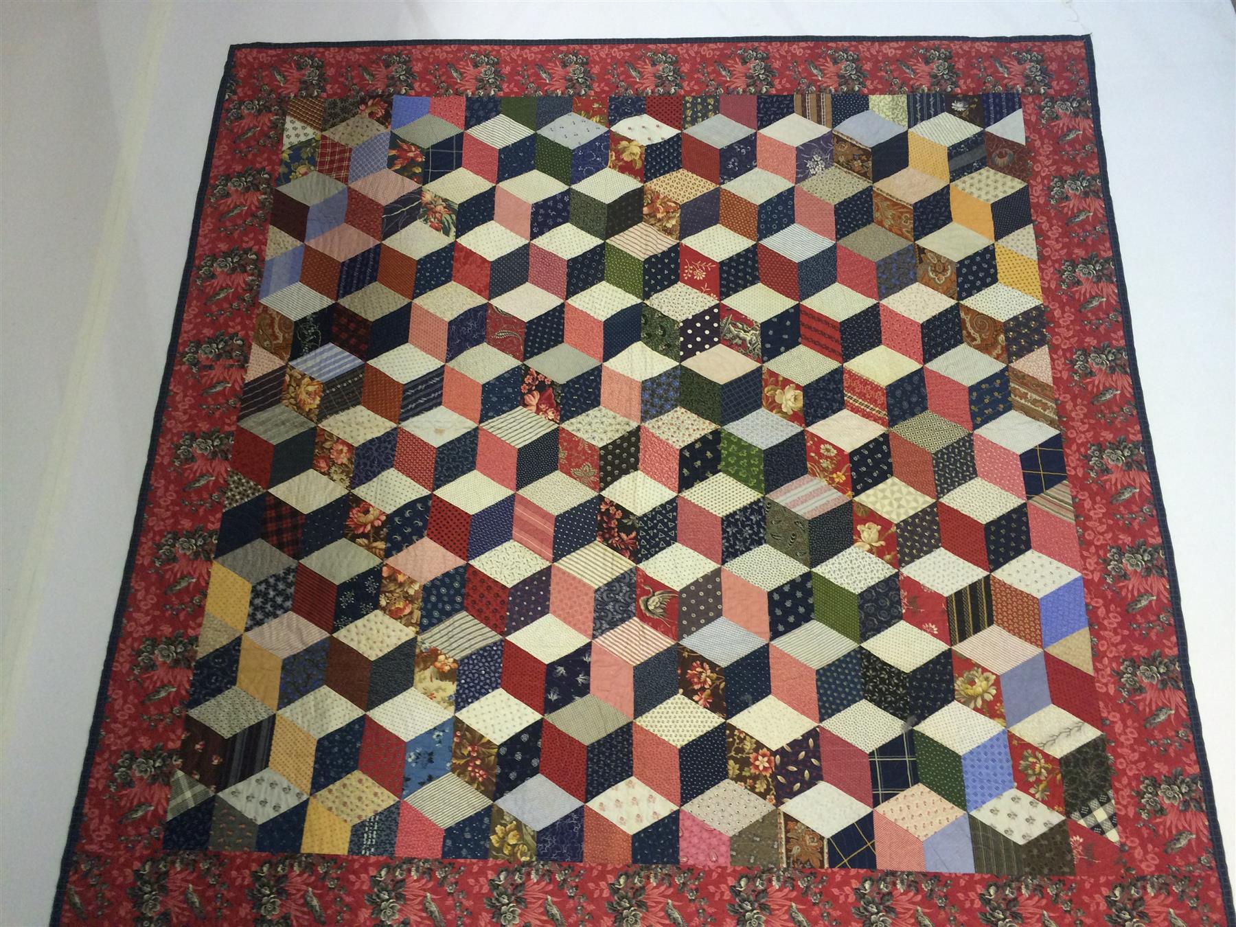 Appraisal: HAND STITCHED TUMBLING BLOCK PATTERN QUILT American mid th century