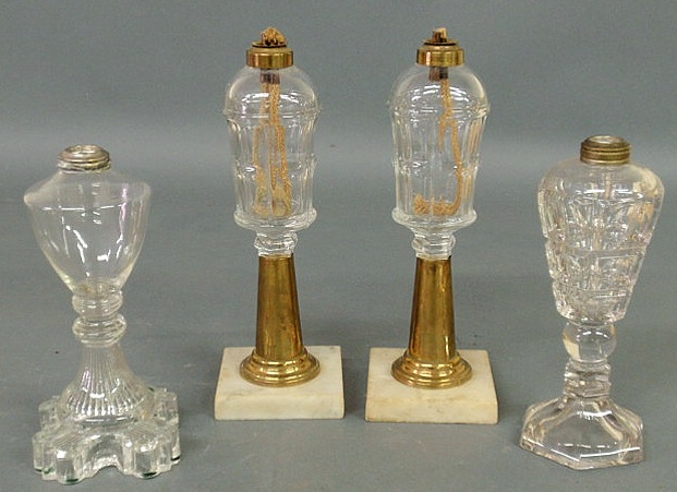 Appraisal: Pair of fluid lamps th c with clear fonts brass